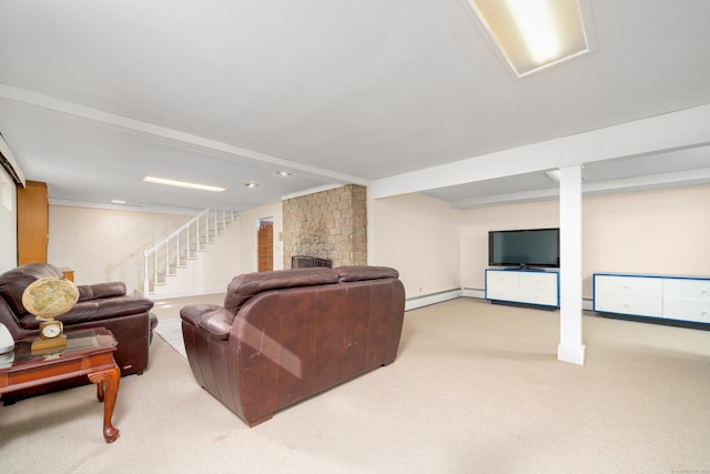 carpeted living area with stairway, a brick fireplace, and baseboard heating