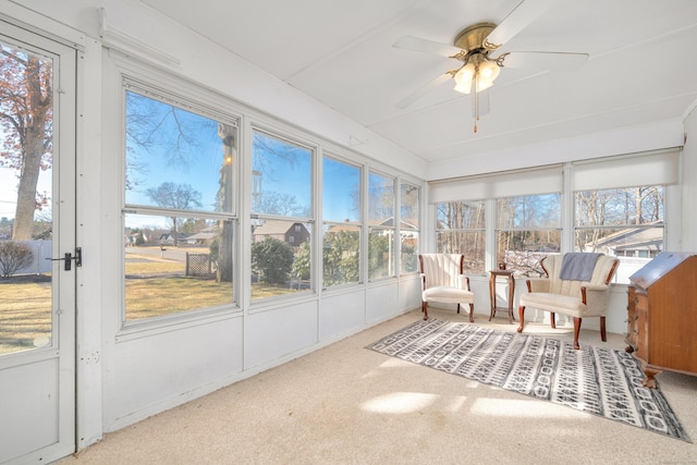 sunroom / solarium featuring plenty of natural light and ceiling fan