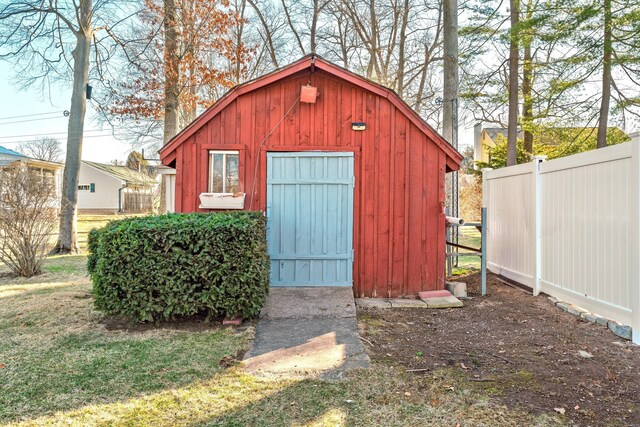 view of shed with fence