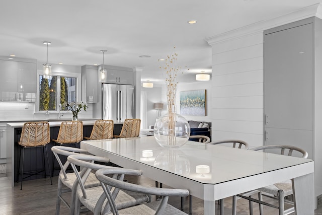 dining space featuring recessed lighting and wood finished floors