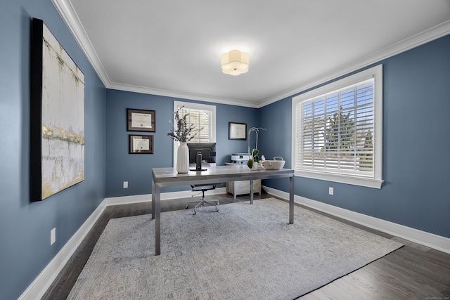 home office featuring visible vents, wood finished floors, baseboards, and ornamental molding