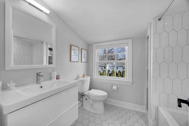 full bathroom featuring vanity, baseboards, lofted ceiling, bathing tub / shower combination, and toilet