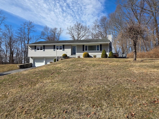 ranch-style home featuring driveway, a chimney, an attached garage, and a front yard