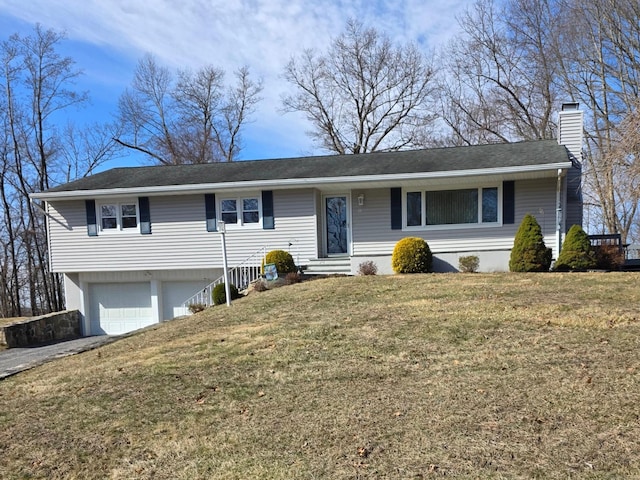 ranch-style home featuring entry steps, aphalt driveway, a front yard, an attached garage, and a chimney