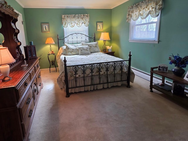 bedroom with ornamental molding, baseboards, and carpet floors