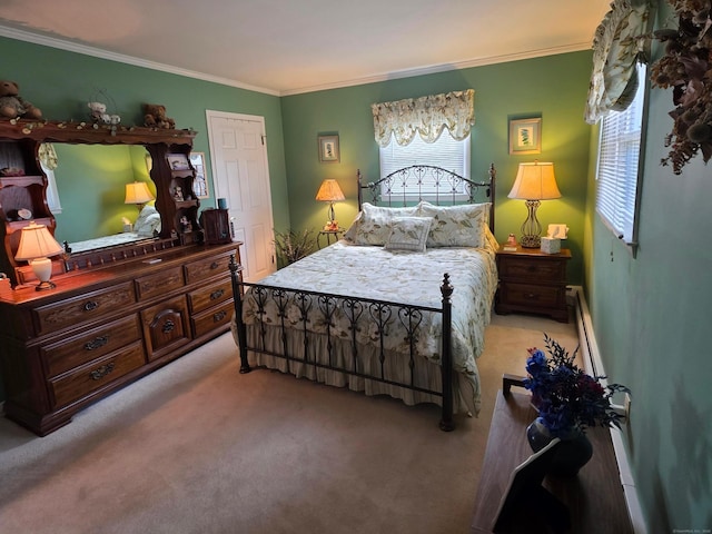 bedroom featuring ornamental molding, a baseboard heating unit, and carpet floors