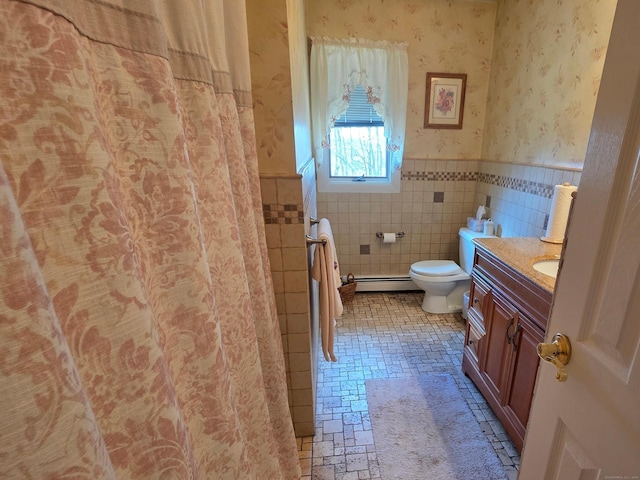 full bath with a wainscoted wall, toilet, tile walls, wallpapered walls, and a baseboard radiator