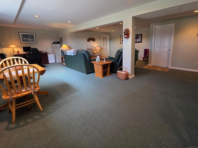 carpeted living area featuring recessed lighting and baseboards