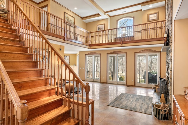 foyer entrance with baseboards, a high ceiling, recessed lighting, stairs, and tile patterned floors