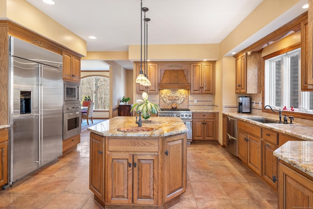 kitchen with backsplash, a center island, built in appliances, custom range hood, and a sink