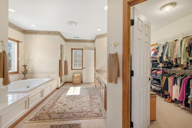 full bath featuring tile patterned flooring, recessed lighting, a spacious closet, and a bath