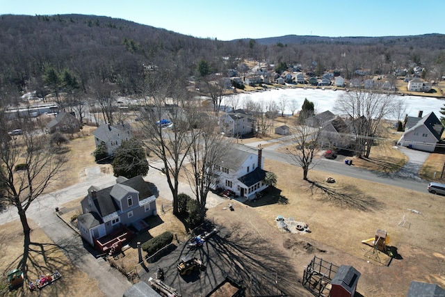 birds eye view of property with a wooded view