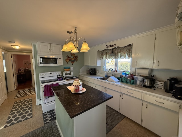 kitchen featuring white cabinetry, white appliances, and a sink