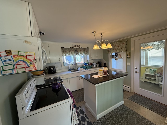 kitchen featuring a baseboard radiator, white range with electric cooktop, a sink, white cabinetry, and a center island