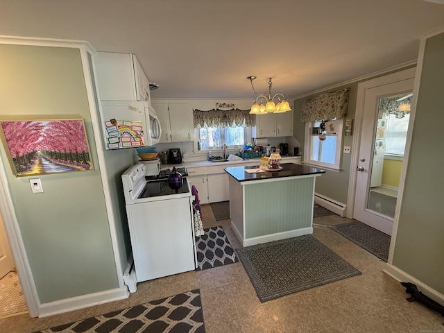 kitchen with a sink, white cabinets, electric stove, a chandelier, and a center island