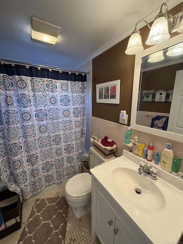 bathroom with toilet, a shower with shower curtain, ornamental molding, tile patterned floors, and tile walls