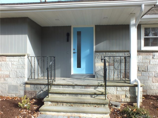 view of exterior entry with stone siding