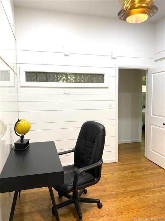 office with light wood-type flooring