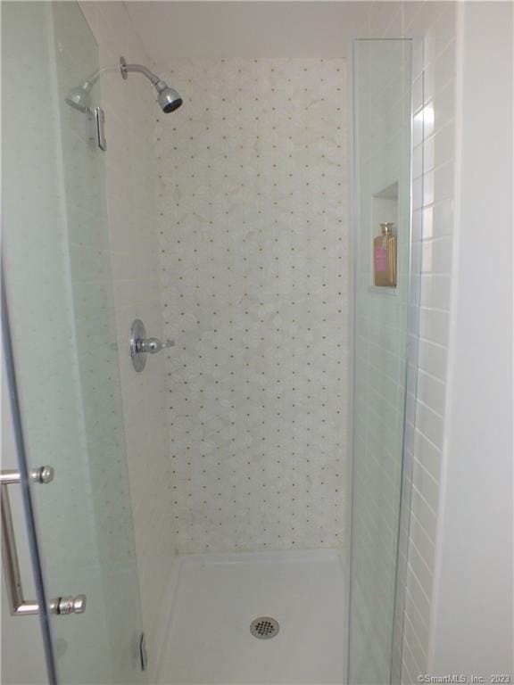 bathroom with a shower stall