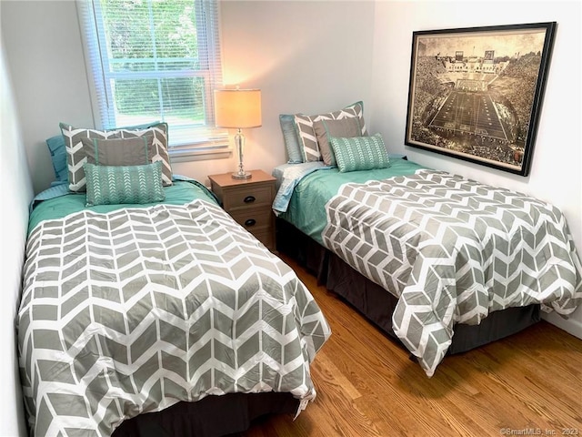 bedroom with wood finished floors