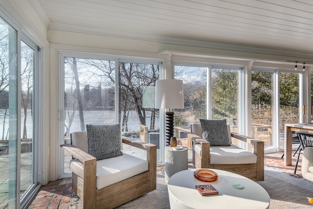 sunroom featuring ornamental molding