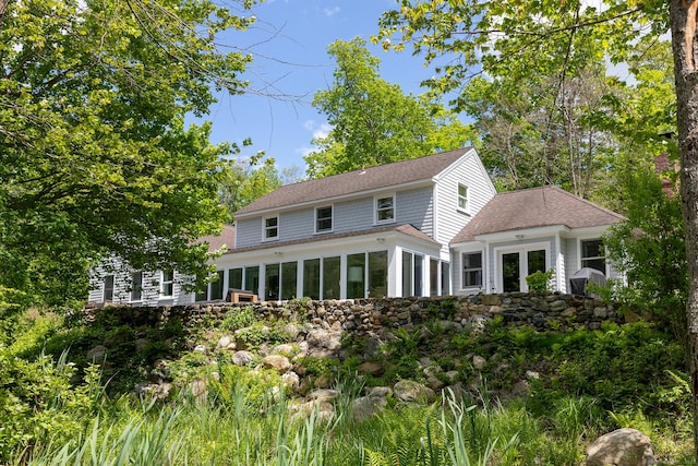 56 Mount Tom Passway Passway, Morris, CT 06763 - rear view of house with a sunroom and roof with shingles