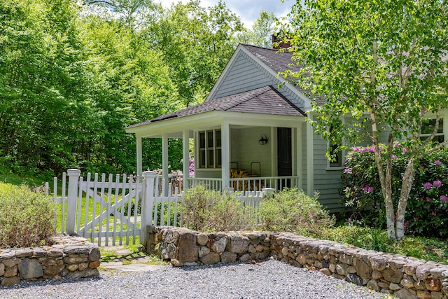56 Mount Tom Passway Passway, Morris, CT 06763 - view of front of house with roof with shingles and a gate