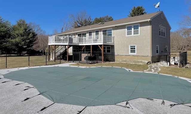 back of property featuring stairs, a patio area, fence, and a wooden deck