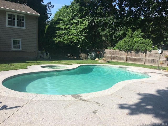 view of swimming pool featuring a fenced in pool, fence, central AC, a patio area, and an in ground hot tub