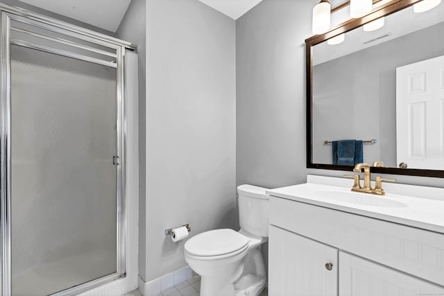 bathroom with tile patterned floors, toilet, a stall shower, and vanity