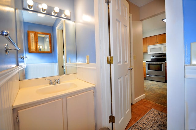 bathroom featuring tile patterned flooring and vanity