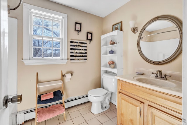 bathroom with tile patterned floors, a baseboard radiator, toilet, and vanity