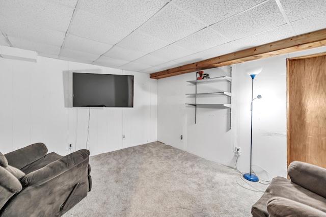 finished basement with a drop ceiling and carpet