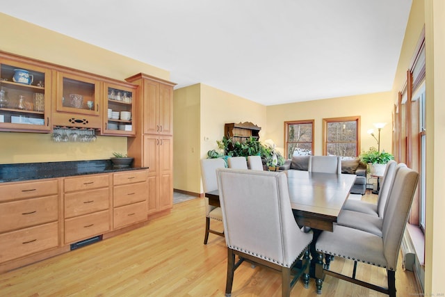 dining space with light wood finished floors