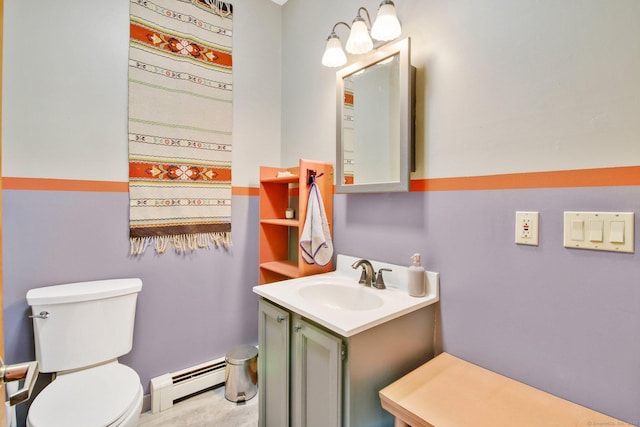 bathroom featuring vanity, toilet, and a baseboard radiator