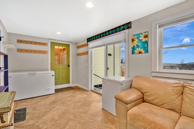 interior space with recessed lighting and baseboards