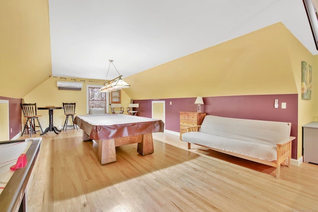 recreation room featuring wood finished floors, baseboards, pool table, vaulted ceiling, and a wall mounted air conditioner