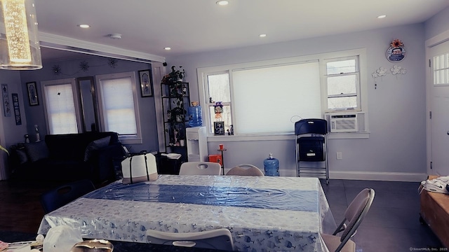 dining space featuring cooling unit, recessed lighting, and baseboards