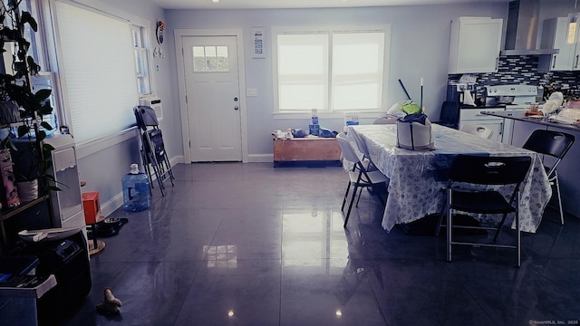 dining space featuring baseboards