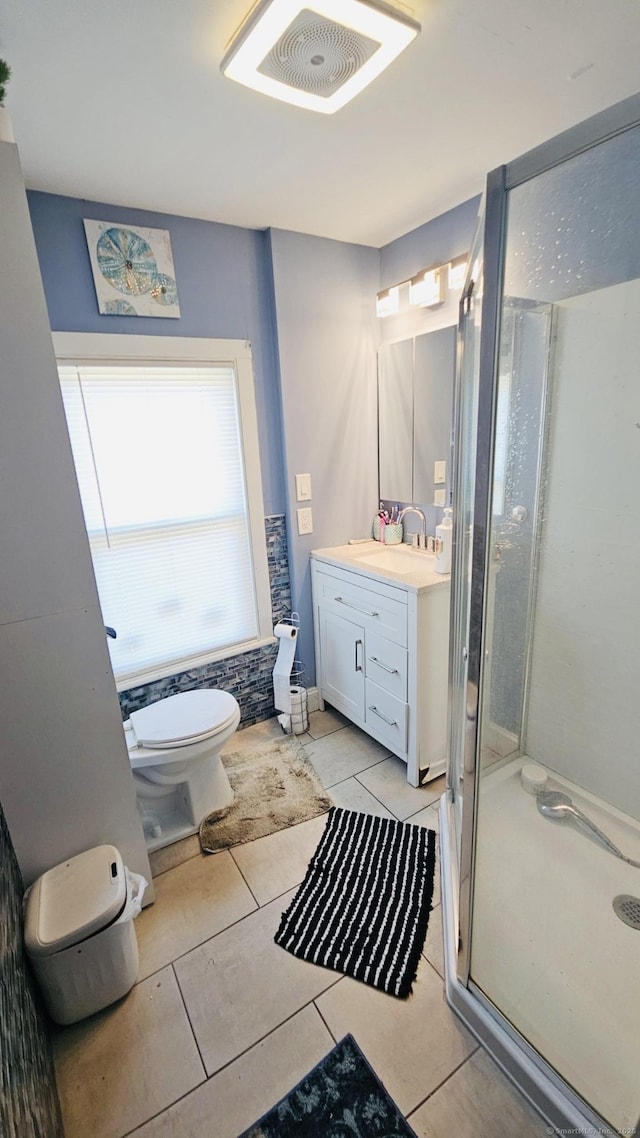 full bath featuring visible vents, toilet, a stall shower, tile patterned flooring, and vanity