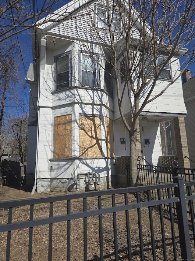 view of front of home with fence