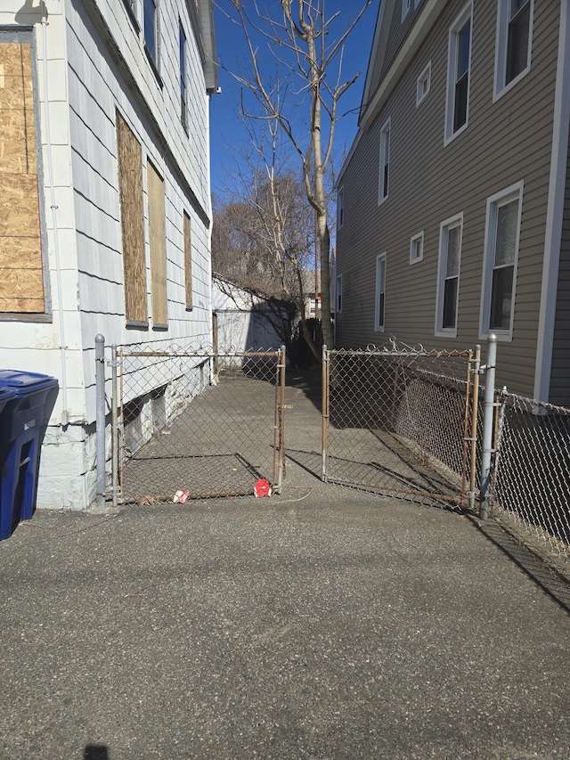 view of side of home with fence