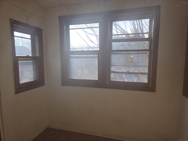 spare room featuring dark wood-style flooring