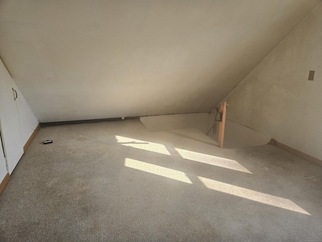 bonus room featuring carpet and lofted ceiling