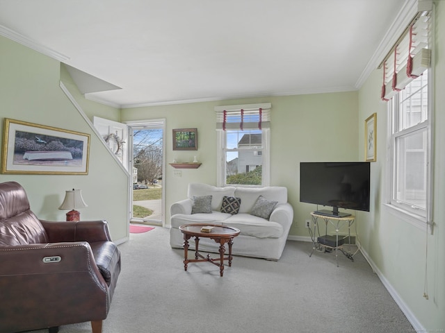 carpeted living area featuring baseboards and ornamental molding