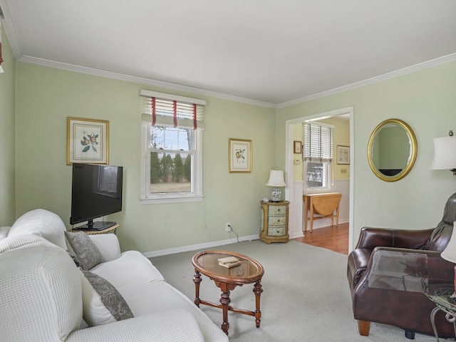 carpeted living room with baseboards and ornamental molding