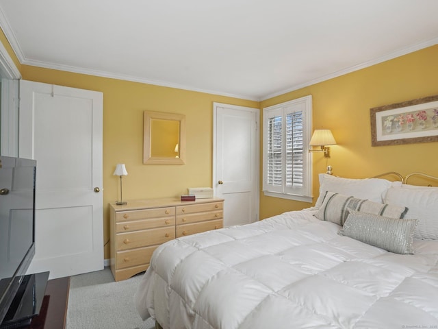 bedroom with crown molding and carpet