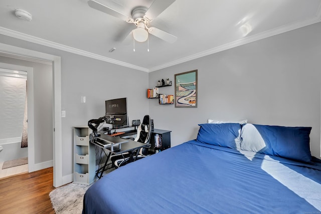 bedroom featuring a ceiling fan, wood finished floors, baseboards, and ornamental molding