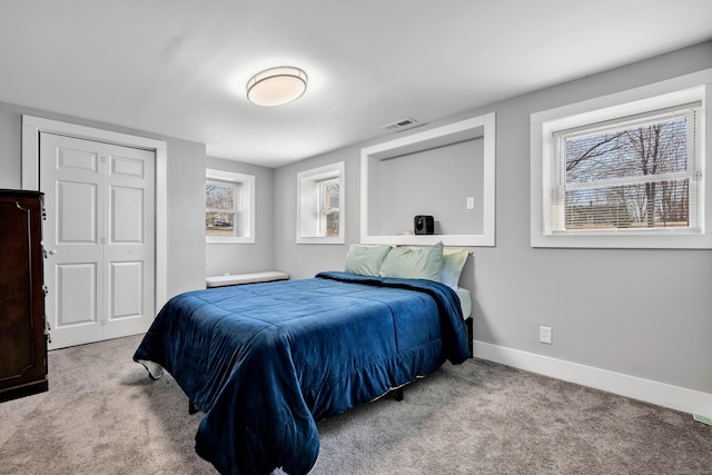 bedroom featuring carpet flooring, baseboards, and visible vents