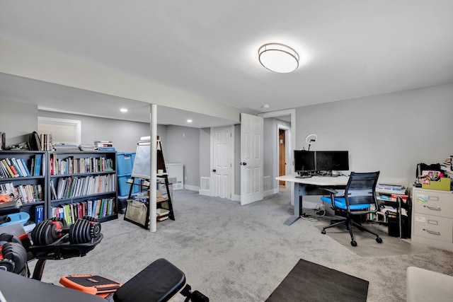 carpeted home office with visible vents and baseboards